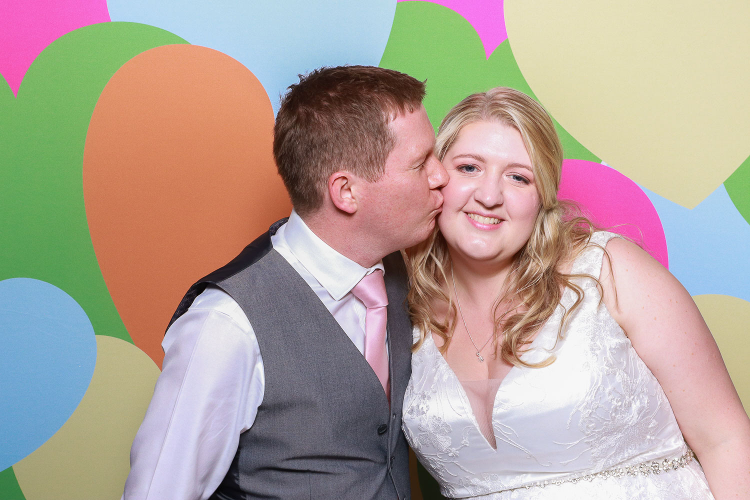 Couple kissing in the Vintage photo booth at wood hall wedding